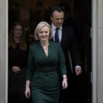 
              Outgoing British Prime Minister Liz Truss, center, arrives to deliver a speech at 10 Downing Street in London, Tuesday, Oct. 25, 2022. Former Treasury chief Rishi Sunak is set to become Britain's first prime minister of color after being chosen Monday to lead a governing Conservative Party desperate for a safe pair of hands to guide the country through economic and political turbulence. (AP Photo/Alastair Grant)
            