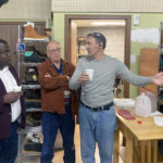
              Michigan Republican U.S. House candidate John Gibbs, left, talks with Liberty Footwear shoe factory owner Petr Kovarik, right, during a voter meet-and-greet, while Grand Rapids resident Bob Firlit, center, listens, in Grand Rapids, Mich., Thursday, Oct. 6, 2022. Gibbs has been endorsed by former President Donald Trump and is working to appeal to independent and swing voters in a Western Michigan congressional district which has new boundaries that likely make it more favorable to Gibbs’ Democratic opponent, Hillary Scholten. (AP Photo/Will Weissert)
            