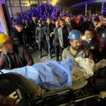 
              Miners carry the body of a victim in Amasra, in the Black Sea coastal province of Bartin, Turkey, Friday, Oct. 14, 2022. An official says an explosion inside a coal mine in northern Turkey has trapped dozens of miners. At least 14 have come out alive. The cause of Friday's blast in the town of Amasra in the Black Sea coastal province of Bartin was not immediately known. (Nilay Meryem Comlek/Depo Photos via AP)
            