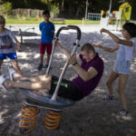 
              Maksim, left, Eduardo, Timofey, front center, and Varvara, right, play in a park in Loue, western France, Saturday, July 2, 2022. An Associated Press investigation has found that Russia’s strategy to take Ukrainian orphans and bring them up as Russian is well underway. After two months of negotiation and an initial objection from a senior Russian official, DPR authorities finally agreed to allow a volunteer with power of attorney from their mother to collect them. (AP Photo/Jeremias Gonzalez)
            