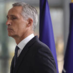 
              NATO Secretary General Jens Stoltenberg gestures as he arrives for a meeting of NATO defense ministers at NATO headquarters in Brussels, Wednesday, Oct. 12, 2022. (AP Photo/Olivier Matthys)
            