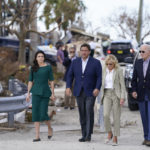 
              President Joe Biden and first lady Jill Biden arrive to tour an area impacted by Hurricane Ian with Florida Gov. Ron DeSantis and his wife Casey DeSantis on Wednesday, Oct. 5, 2022, in Fort Myers Beach, Fla. (AP Photo/Evan Vucci)
            