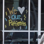 
              A community message is painted on a window of the publicly owned Greenwood Leflore Hospital, in Greenwood, Miss., Friday, Oct. 21, 2022. The hospital has announced the permanent closure of its labor and delivery unit, saying it can't pay competitive wages to nurses. The closure means the area's women will need to travel about 45 minutes to give birth at a hospital, and without focused hospital support, the city's only OB/GYN clinic could struggle to provide maternity care. (AP Photo/Rogelio V. Solis)
            