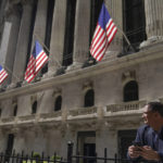 
              FILE - A trader stands outside the New York Stock Exchange, Friday, Sept. 23, 2022, in New York.   (AP Photo/Mary Altaffer)
            