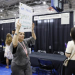 
              A Dallas school administrator carries a sign looking for Spanish language teachers, even if they are uncertified, during a job fair at Emmett J. Conrad High School, in Dallas, Thursday, Aug. 4, 2022. The school district, like many across Texas and the south, has increased its reliance on uncertified teachers as officials scramble to keep classrooms filled with educators. (Elías Valverde II/The Dallas Morning News)
            