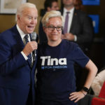 
              President Joe Biden stands with Tina Kotek, the Oregon Democratic nominee for governor, as he speaks during a grassroots volunteer event with the Oregon Democrats at the SEIU Local 49 in Portland, Ore. Friday, Oct. 14, 2022. (AP Photo/Carolyn Kaster)
            