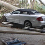 
              In this undated image from video, a damaged vehicle and debris are seen on Sanibel Island, Fla. Chuck Larsen's home was slammed by Hurricane Ian and he spent a harrowing few days on the isolated island before being evacuated over the weekend. (Chuck Larsen/SantivaChronicle.com via AP)
            