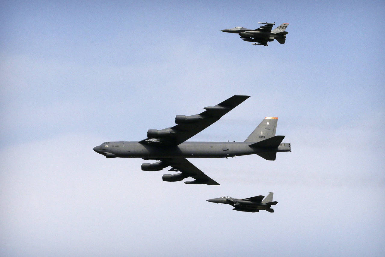 FILE - A U.S. Air Force B-52 bomber flies over Osan Air Base in Pyeongtaek, South Korea, Jan 10, 20...