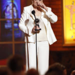
              FILE - Angela Lansbury accepts her Tony Award for Best Performance by a Featured Actress in a Play for her role in "Blithe Spirit" at the 63rd Annual Tony Awards in New York on June 7, 2009. Lansbury, the big-eyed, scene-stealing British actress who kicked up her heels in the Broadway musicals “Mame” and “Gypsy” and solved endless murders as crime novelist Jessica Fletcher in the long-running TV series “Murder, She Wrote,” died peacefully at her home in Los Angeles on Tuesday. She was 96. (AP Photo/Seth Wenig, File)
            
