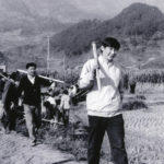 
              FILE - In this photo provided by China's Xinhua News Agency, Communist Party Leader Xi Jinping, right, then secretary of the Ningde Prefecture Committee of the Communist Party of China (CPC), participates in farm work during his investigation in the countryside in 1988. When Xi Jinping came to power in 2012, it wasn't clear what kind of leader he would be. His low-key persona during a steady rise through the ranks of the Communist Party gave no hint that he would evolve into one of modern China's most dominant leaders, or that he would put the economically and militarily ascendant country on a collision course with the U.S.-led international order. (Xinhua via AP, File)
            