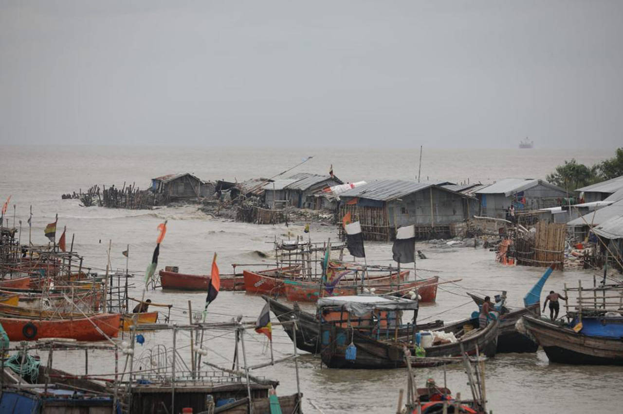 Fishermen on the Bay of Bengal coast secure their boats anticipating a storm in Patenga, Chittagong...