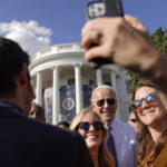 
              FILE - President Joe Biden poses for photos after speaking about the Inflation Reduction Act of 2022 during a ceremony on the South Lawn of the White House in Washington, Sept. 13, 2022. (AP Photo/Andrew Harnik, File)
            