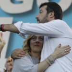 
              FILE - Giorgia Meloni and Matteo Salvini, right, hug each other as they address a rally in Rome, Saturday, Oct. 19, 2019. As a young teen, Italy's Giorgia Meloni embarked on an ideological quest that has propelled her to the verge of government power. The Sept. 25 election victory of her Brothers of Italy, a party with neo-fascist roots that she helped establish a decade ago, provided Meloni with a springboard into the Italian premiership. (AP Photo/Andrew Medichini, File)
            