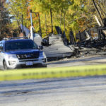 
              Investigators examine the site of a plane crash in Keene, N.H. on Saturday, Oct. 22, 2022. The Federal Aviation Administration said in a statement Saturday that a single-engine Beechcraft Sierra aircraft crashed Friday evening into a building north of Keene Dillant-Hopkins Airport. City officials said on their Facebook page that no one was injured in the building but that “those on the plane have perished." (Kristopher Radder /The Brattleboro Reformer via AP)
            