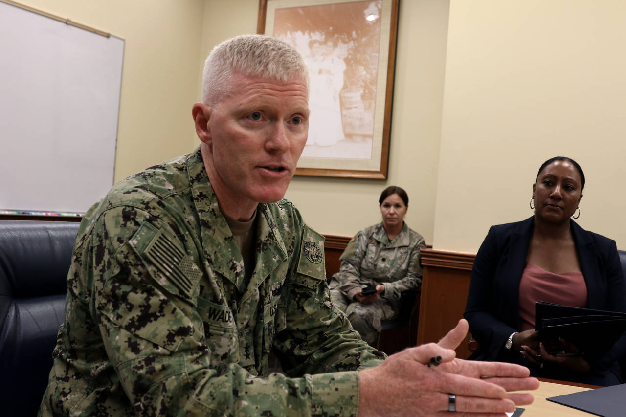 Navy Rear Adm. John Wade, commander of Joint Task Force Red Hill, speaks to reporters at a media ro...