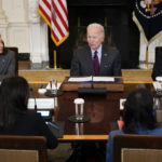 
              President Joe Biden speaks during a meeting of the reproductive rights task force in the State Dining Room of the White House in Washington, Tuesday, Oct. 4, 2022. Vice President Kamala Harris, left, and Education Secretary Miguel Cardona, right, listen. (AP Photo/Susan Walsh)
            