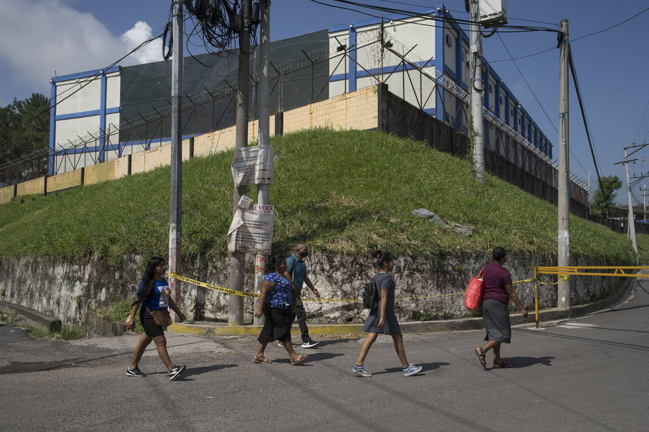 People arrive to the Mariona prison, a main penitentiary for men, to deliver food and personal item...
