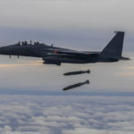 
              In this photo provided by South Korea Defense Ministry, South Korean Air Force's F15K fighter jet fires 2 JDAM (Joint Direct Attack Munition ) bombs into an island target in South Korea, Tuesday, Oct. 4, 2022. The South Korean and U.S. militaries responded to a North Korea morning missile launch by launching fighter jets which fired weapons at a target off South Korea's west coast in a show of strength against North Korea. (South Korea Defense Ministry via AP)
            