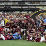 
              Brazil's Flamengo players celebrate with the trophy after winning the Copa Libertadores final soccer match against Brazil's Athletico Paranaense at the Monumental Stadium in Guayaquil, Ecuador, Saturday, Oct. 29, 2022. (AP Photo/Dolores Ochoa)
            