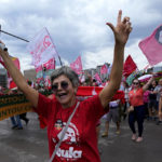 
              Supporters of Brazil's former President Luiz Inacio Lula da Silva take part in a campaign event in Brasilia, Brazil, Saturday, Oct. 29, 2022. On Sunday, Brazilians head to the voting booth again to choose between da Silva and incumbent Jair Bolsonaro who are facing each other in a runoff vote after neither got enough support to win outright in the Oct. 2 general election. (AP Photo/Eraldo Peres)
            