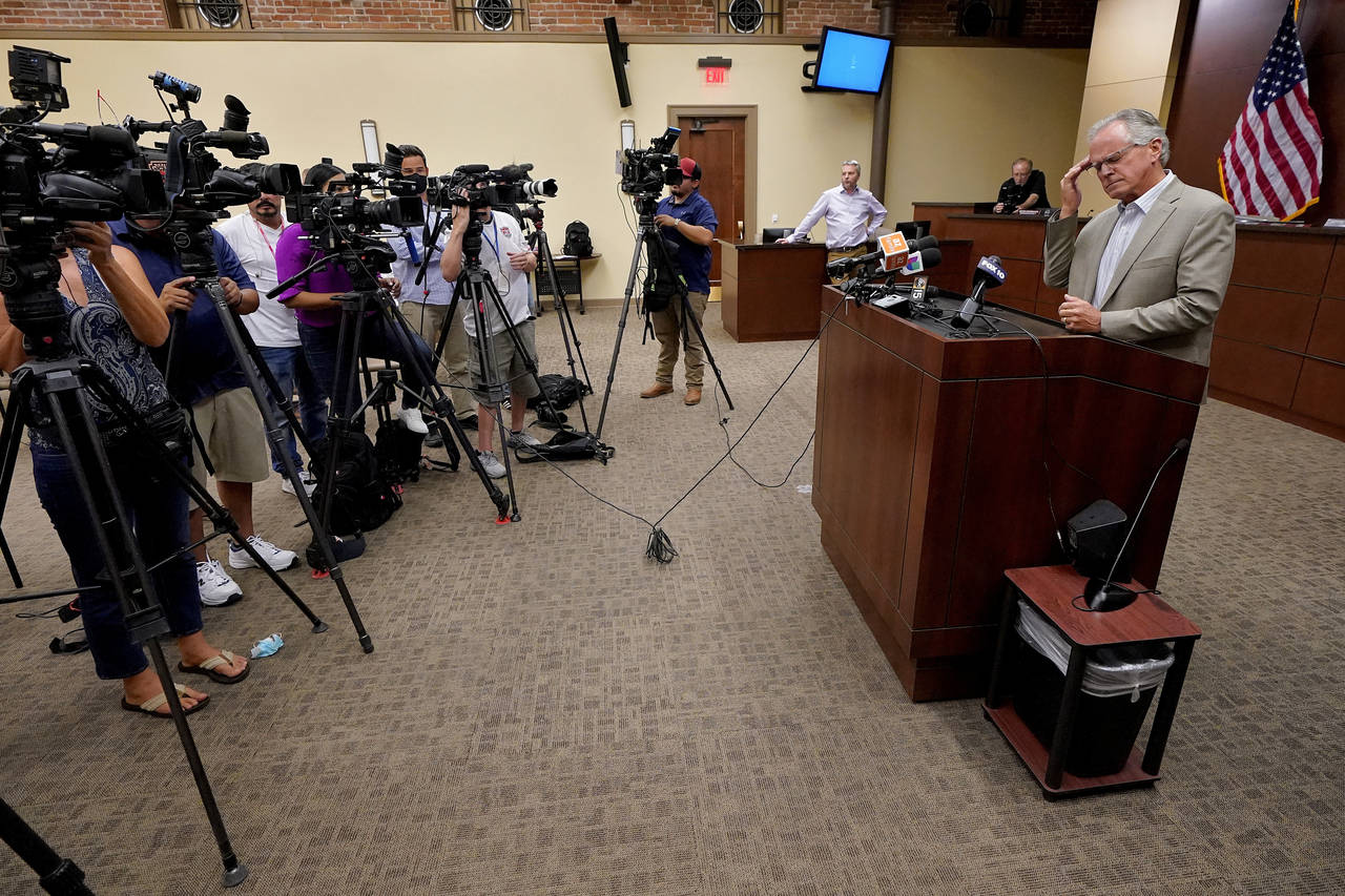 FILE - Pinal County Board of Supervisors Chairman Jeffrey McClure rubs his head while addressing ba...