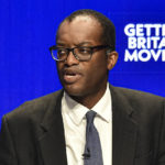 
              Britain's Chancellor of the Exchequer Kwasi Kwarteng speaks at the Conservative Party conference at the ICC in Birmingham, England, Monday, Oct. 3, 2022. The British government has dropped plans to cut income tax for top earners, part of a package of unfunded cuts that sparked turmoil on financial markets and sent the pound to record lows. (AP Photo/Rui Vieira)
            