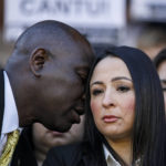 
              Attorney Benjamin Crump whispers to Victoria Casarez as they hold a press conference to update the public about his current medical condition in front of the Bexar County Courthouse in San Antonio, Tuesday, Oct. 25, 2022. Cantu was shot multiple times by former San Antonio police officer James Brennand on Oct. 2. (Sam Owens/The San Antonio Express-News via AP)
            