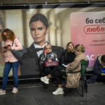 
              People sit in the Kyiv subway, using it as a bomb shelter, Ukraine, on Wednesday, Oct. 19, 2022. (AP Photo/Emilio Morenatti)
            