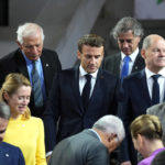 
              French President Emmanuel Macron, center, stands with other EU leaders prior to a group photo during an EU Summit at Prague Castle in Prague, Czech Republic, Friday, Oct 7, 2022. European Union leaders converged on Prague Castle Friday to try to bridge significant differences over a natural gas price cap as winter approaches and Russia's war on Ukraine fuels a major energy crisis. (AP Photo/Petr David Josek)
            