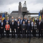 
              Poland's Prime Minister Mateusz Morawiecki, third from left, European Commission President Ursula von der Leyen, fourth from left, Ukrainian Prime Minister Denis Shmyhal, fifth from left, German Chancellor Olaf Scholz, fifth from right, and Swiss President Ignazio Cassis, fourth from right, pose with other participants for a group photo during the International Expert Conference on the Recovery, Reconstruction and Modernisation of Ukraine, in Berlin, Germany, Tuesday, Oct. 25, 2022. German and European Union leaders gathered experts on Tuesday to start work on what they describe as a "new Marshall plan" for the rebuilding of Ukraine. (AP Photo/Markus Schreiber)
            