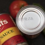 
              A "best by" date is seen on the top of a tomato sauce can, Saturday, Aug. 20, 2022, in Boston.  As awareness grows around the world about the problem of food waste, one culprit in particular is drawing scrutiny: “best before” labels. Manufacturers have used the labels for decades to estimate peak freshness. Unlike “use by” labels, which are found on perishable foods like meat and dairy, “best before” labels have nothing to do with safety and may encourage consumers to throw away food that’s perfectly fine to eat. (AP Photo/Michael Dwyer)
            