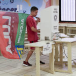 
              A supporter of former Brazilian President Luiz Inacio Lula da Silva, who is running for president again, votes during a run-off election in Brasilia, Brazil, Sunday, Oct. 30, 2022. (AP Photo/Eraldo Peres)
            