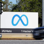 
              FILE - A car passes Facebook's new Meta logo on a sign at the company headquarters, on Oct. 28, 2021, in Menlo Park, Calif. A Nigerian advertising regulator has sued Meta, accusing the owner of Facebook and WhatsApp of publishing unauthorized ads. (AP Photo/Tony Avelar, File)
            