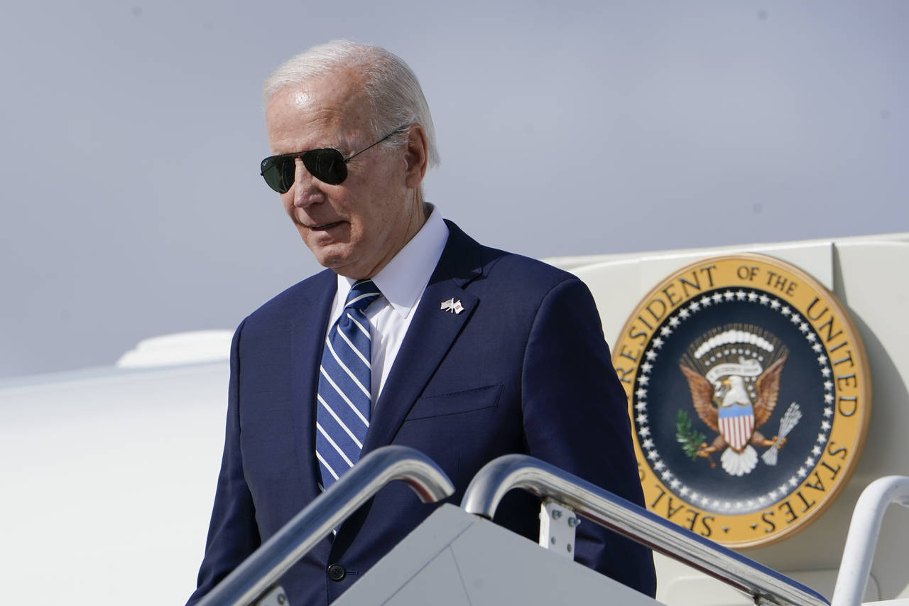 President Joe Biden exits Air Force One as he arrives at Hancock Field Air National Guard Base in M...