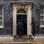 
              A police officer knocks on the door to 10 Downing Street in London, Thursday, Oct. 20, 2022. (AP Photo/Alberto Pezzali)
            