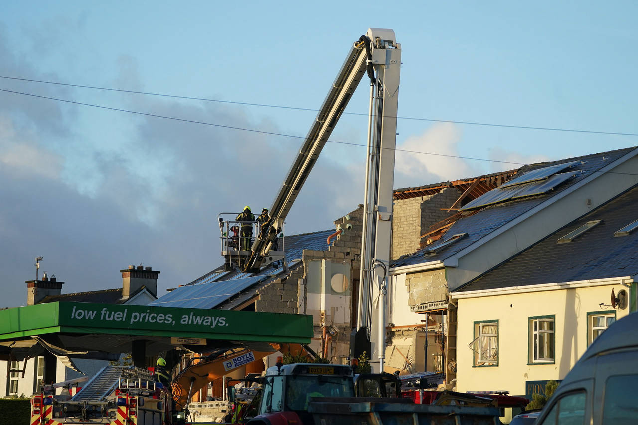 Emergency services work at the scene of an explosion at Applegreen service station in the village o...