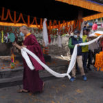 
              Buddhist monks perform rituals during the funeral of famed American extreme skier Hilaree Nelson in Kathmandu, Nepal, Sunday, Oct.2, 2022. Nelson had died last week on Mount Manaslu while coming down from the top of the summit the 8,163-meter (26,775-foot) world's eighth-highest mountain. (AP Photo/Niranjan Shrestha)
            