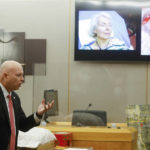 
              Prosecutor Glen Fitzmartin delivers his closing statement as picture of victim Mary Bartel displays on the screen during the final day of the third trial of Billy Chemirmir at Frank Crowley Courts Building in Dallas on Friday, Oct. 7, 2022. Chemirmir, 49, is charged with capital murder of 22 elderly people in North Texas. (Shafkat Anowar/The Dallas Morning News via AP)
            