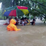 
              In this photo provided by the Philippine Coast Guard, rescuers use an old refrigerator as a float as they evacuate residents from flood waters caused by Tropical Storm Nalgae in Hilongos, Leyte province, Philippines on Friday Oct. 28, 2022. Flash floods and landslides set off by torrential rains left dozens of people dead, including in a hard-hit southern Philippine province, where many villagers are feared missing and buried in a deluge of rainwater, mud, rocks and trees, officials said Saturday. (Philippine Coast Guard via AP)
            