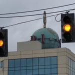 The P-I globe is partially visible from Elliott Avenue along the waterfront; it was moved there in 1985. (Feliks Banel/KIRO Newsradio)