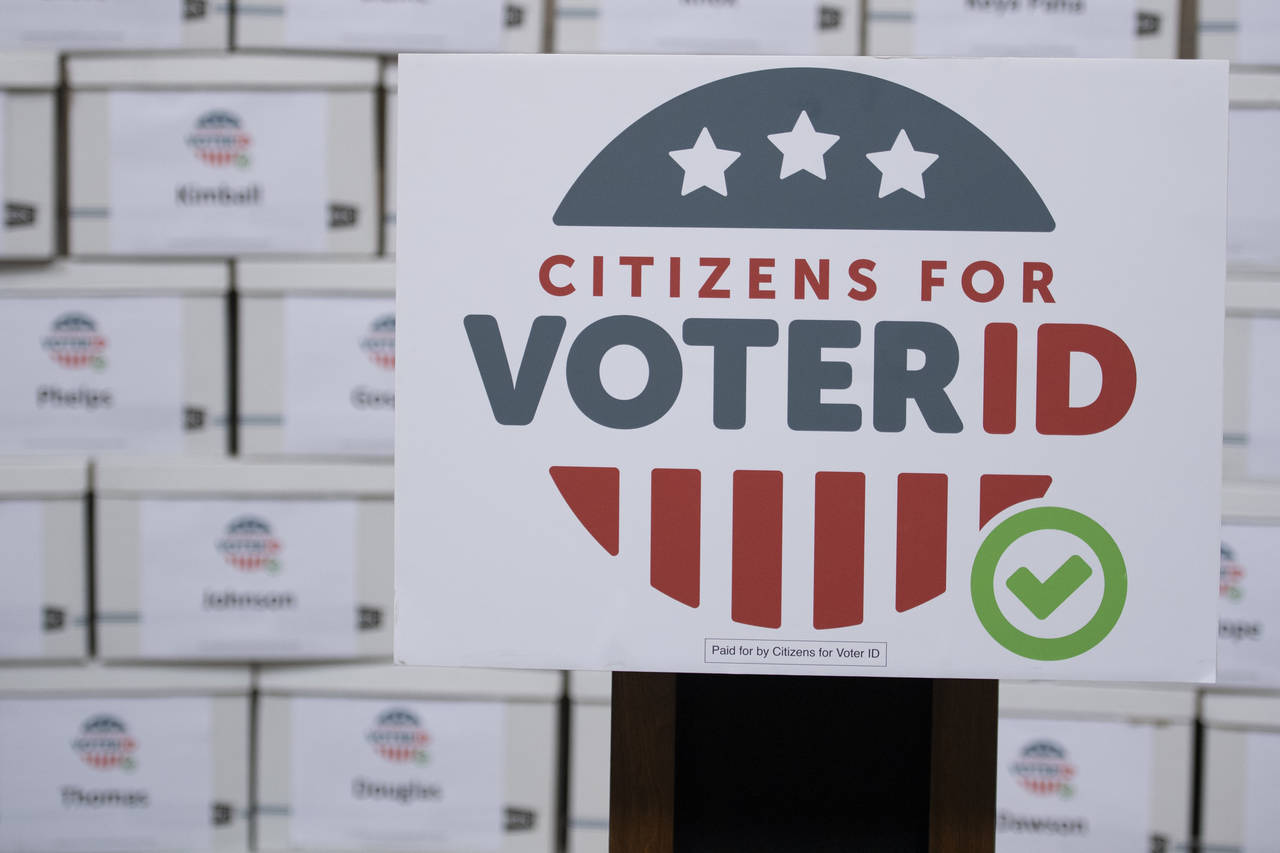 FILE - Boxes of signatures are displayed after a new conference hosted by Citizens for Voter ID at ...