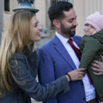 
              Mike Lawler, center, arrives with his wife, Doina, and daughter, Julianna, to a news conference, Wednesday, Nov. 9, 2022, in New City, N.Y. (AP Photo/Mary Altaffer)
            