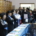 
              Members of the election commission sing the national anthem prior to opening a polling station in Astana, Kazakhstan, Sunday, Nov. 20, 2022. Kazakhstan's president appears certain to win a new term against little-known challengers in a snap election on Sunday. Five candidates are on the ballot against President Kassym-Jomart Tokayev, who faced a bloody outburst of unrest early this year and then moved to marginalize some of the Central Asian country's longtime powerful figures. (AP Photo/Stanislav Filippov)
            