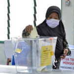 
              A woman votes during the general election at a voting center in Alor Setar, Kedah, Malaysia Saturday, Nov. 19, 2022. Malaysians have begun casting ballots in a tightly contested national election that will determine whether the country’s longest-ruling coalition can make a comeback after its electoral defeat four years ago.  (AP Photo/JohnShen Lee)
            
