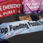 
              FILE - A demonstrator lies on the ground while participating in a protest against fossil fuels at the COP27 U.N. Climate Summit, Nov. 11, 2022, in Sharm el-Sheikh, Egypt. As the U.N. climate talks in Egypt near the half-way point, negotiators are working hard to draft deals on a wide range of issues they’ll put to ministers next week in the hope of getting a substantial result by the end. (AP Photo/Peter Dejong, File)
            