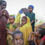 
              A mother and children displaced by drought sit outside their makeshift shelter on the outskirts of Baidoa, in Somalia Saturday, Oct. 29, 2022. Ships loaded with grain departed Ukraine on Tuesday, Nov. 1, 2022 despite Russia suspending its participation in a U.N.-brokered deal that ensures safe wartime passage of critical food supplies meant for parts of the world struggling with hunger such as Somalia. (AP Photo/Mohamed Sheikh Nor)
            