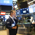 
              Traders work on the floor at the New York Stock Exchange in New York, Monday, Nov. 28, 2022. (AP Photo/Seth Wenig)
            