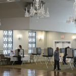 
              People vote at the Crystal Ballroom in New Britain, Conn., Tuesday, Nov. 8, 2022. (AP Photo/Jessica Hill)
            