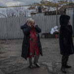 
              Natalia Voblikova, center, reacts after knowing that her son Arthur was seriously injured after a Russian strike in Kherson, southern Ukraine, Tuesday, Nov. 22, 2022. Arthur Voblikova, 13, was injured after a Russian strike, and doctors had to amputate his left arm. As attacks increase in the recently liberated city of Kherson, doctors are struggling to cope amid little water, electricity and a lack of equipment.  (AP Photo/Bernat Armangue)
            