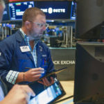 
              Traders work on the floor at the New York Stock Exchange in New York, Wednesday, Nov. 2, 2022. (AP Photo/Seth Wenig)
            